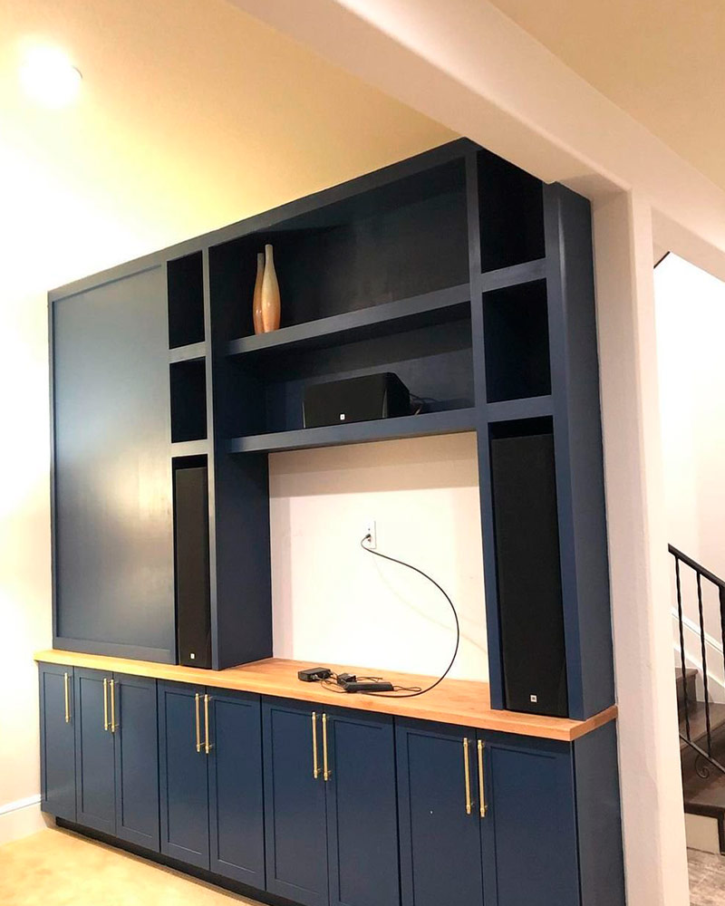 built in tv wall with cabinets